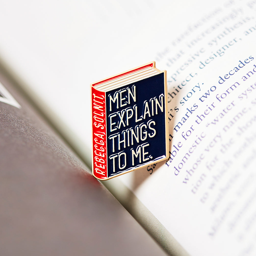 Rebecca Solnit Book Pin Collection, Men explain things to me, Mansplaining Enamel Pin Books, Product Wholesale for Bookstores and Bookshops by Judy Kaufmann