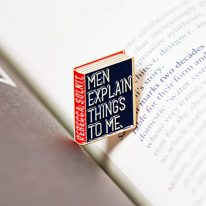 Rebecca Solnit Book Pin Collection, Men explain things to me, Mansplaining Enamel Pin Books, Product Wholesale for Bookstores and Bookshops by Judy Kaufmann
